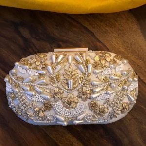 Zupppy Home Decor Oval shaped embroidery heavy work clutch