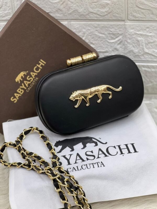Zupppy Accessories Sabyasachi Clutch Replica – PU & Synthetic Material, Branded Dust Cover, Inner Tag, With Box (10×7 Inches)