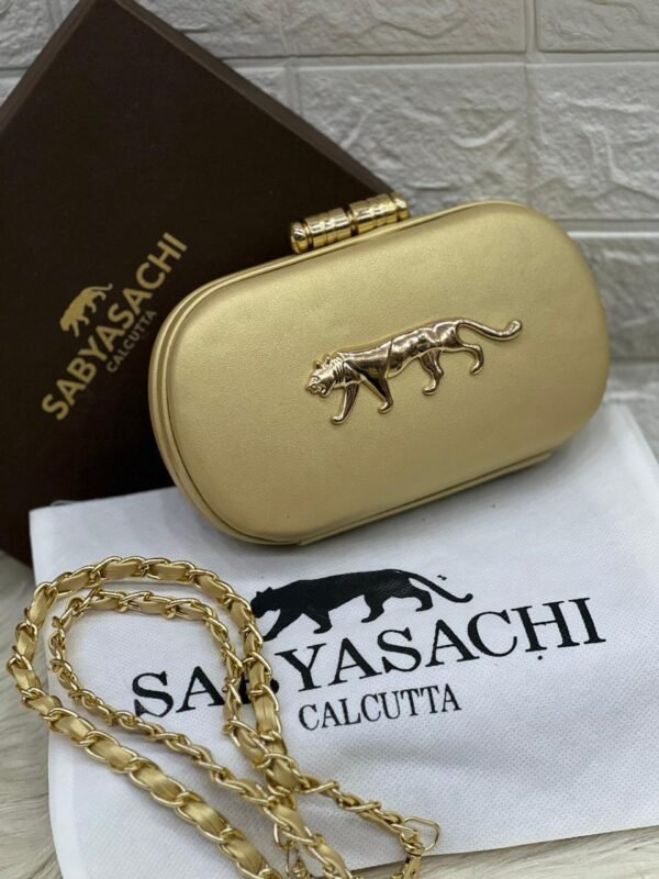 Zupppy Accessories Sabyasachi Clutch Replica – PU & Synthetic Material, Branded Dust Cover, Inner Tag, With Box (10×7 Inches)
