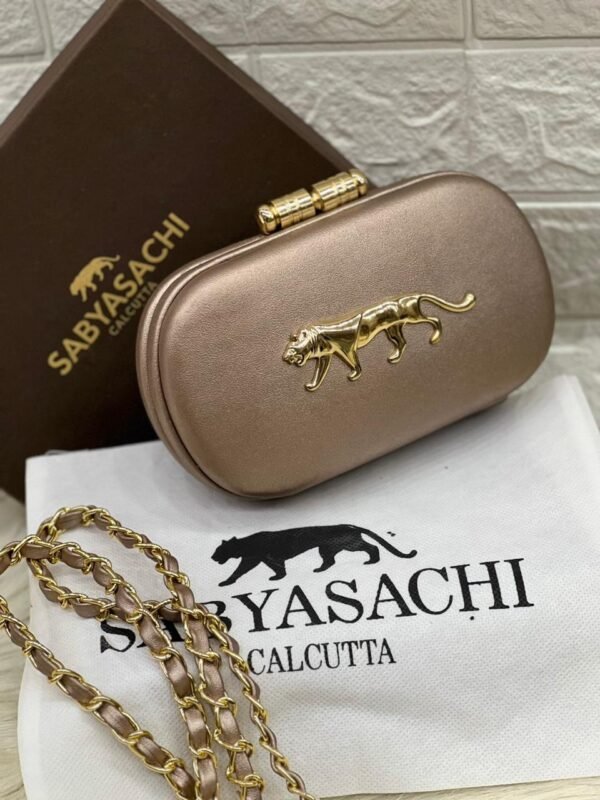 Zupppy Accessories Sabyasachi Clutch Replica – PU & Synthetic Material, Branded Dust Cover, Inner Tag, With Box (10×7 Inches)