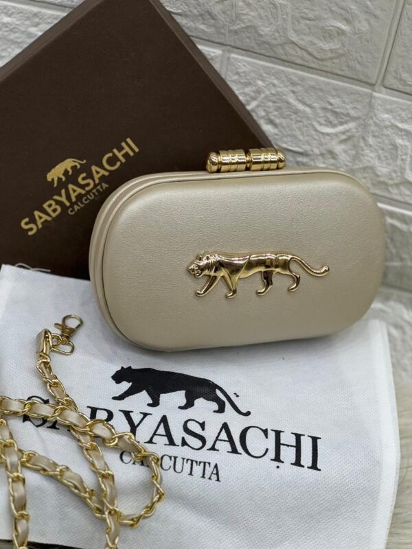 Zupppy Accessories Sabyasachi Clutch Replica – PU & Synthetic Material, Branded Dust Cover, Inner Tag, With Box (10×7 Inches)
