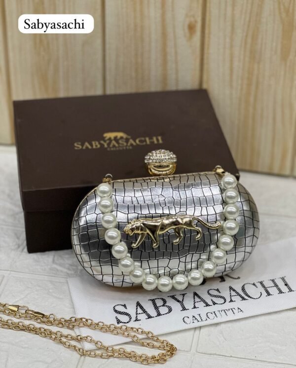 Zupppy Accessories Sabyasachi Clutch Replica – Synthetic Material, Branded Dust Cover, Box Packed