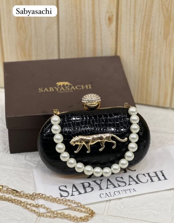 Zupppy Accessories Sabyasachi Clutch Replica – Synthetic Material, Branded Dust Cover, Box Packed