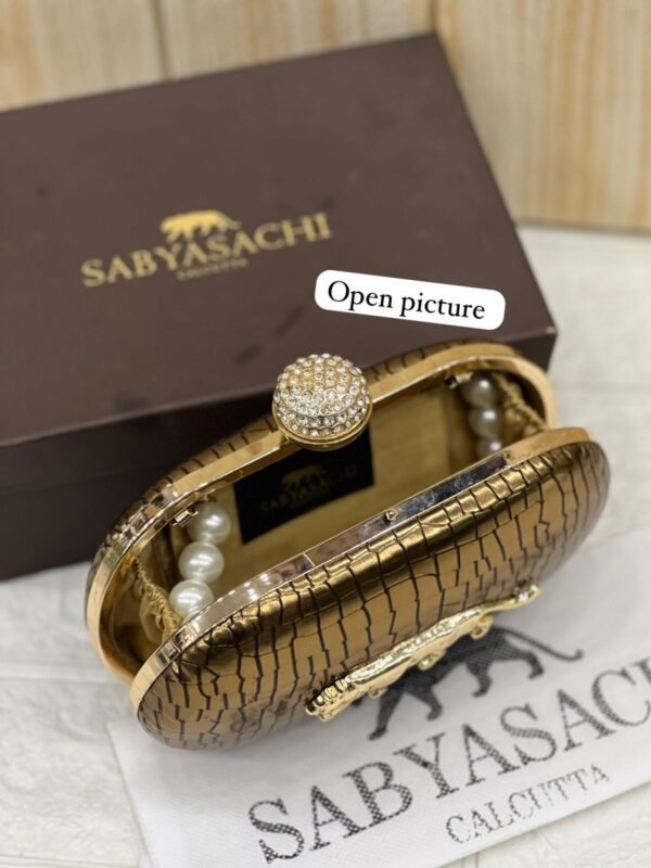 Zupppy Accessories Sabyasachi Clutch Replica – Synthetic Material, Branded Dust Cover, Box Packed