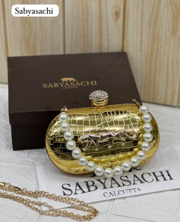 Zupppy Accessories Sabyasachi Clutch Replica – Synthetic Material, Branded Dust Cover, Box Packed