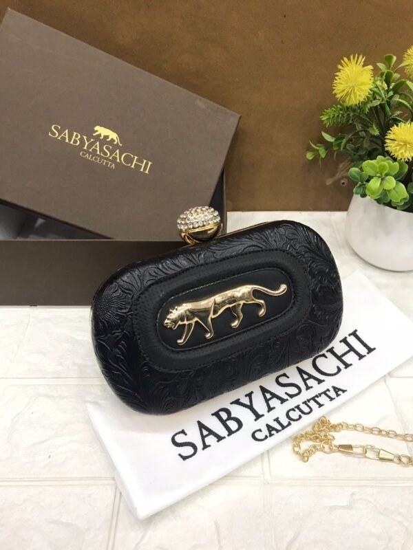 Zupppy Accessories Sabyasachi Clutch Replica – PU & Synthetic Material, Branded Dust Cover, With Box (10×7 Inches)
