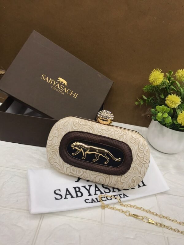 Zupppy Accessories Sabyasachi Clutch Replica – PU & Synthetic Material, Branded Dust Cover, With Box (10×7 Inches)