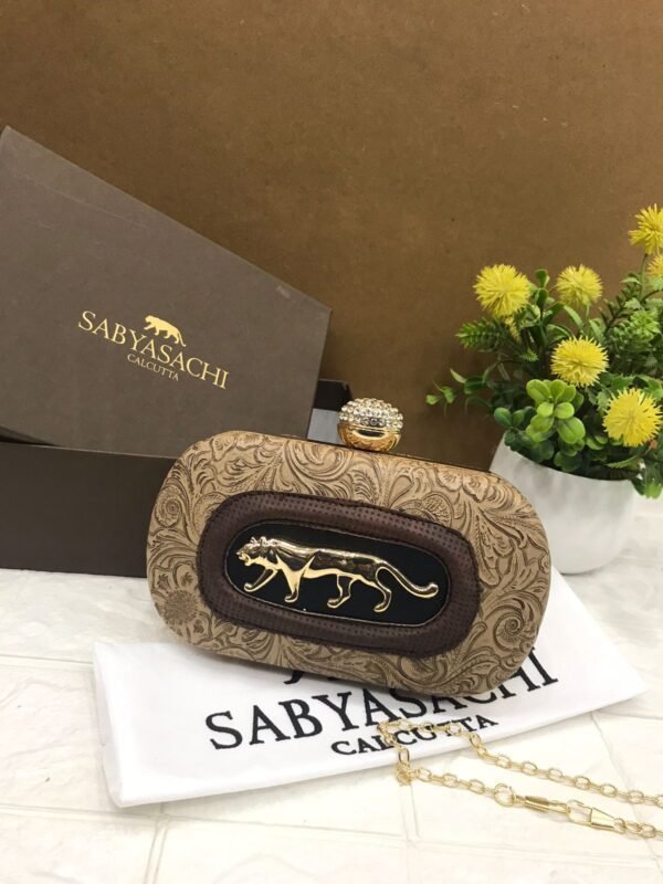 Zupppy Accessories Sabyasachi Clutch Replica – PU & Synthetic Material, Branded Dust Cover, With Box (10×7 Inches)
