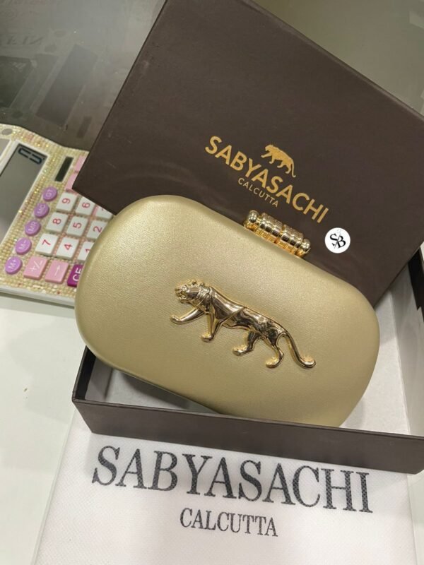 Zupppy Accessories Sabyasachi Clutch Replica – PU & Synthetic Material, Branded Dust Cover, Box Packed