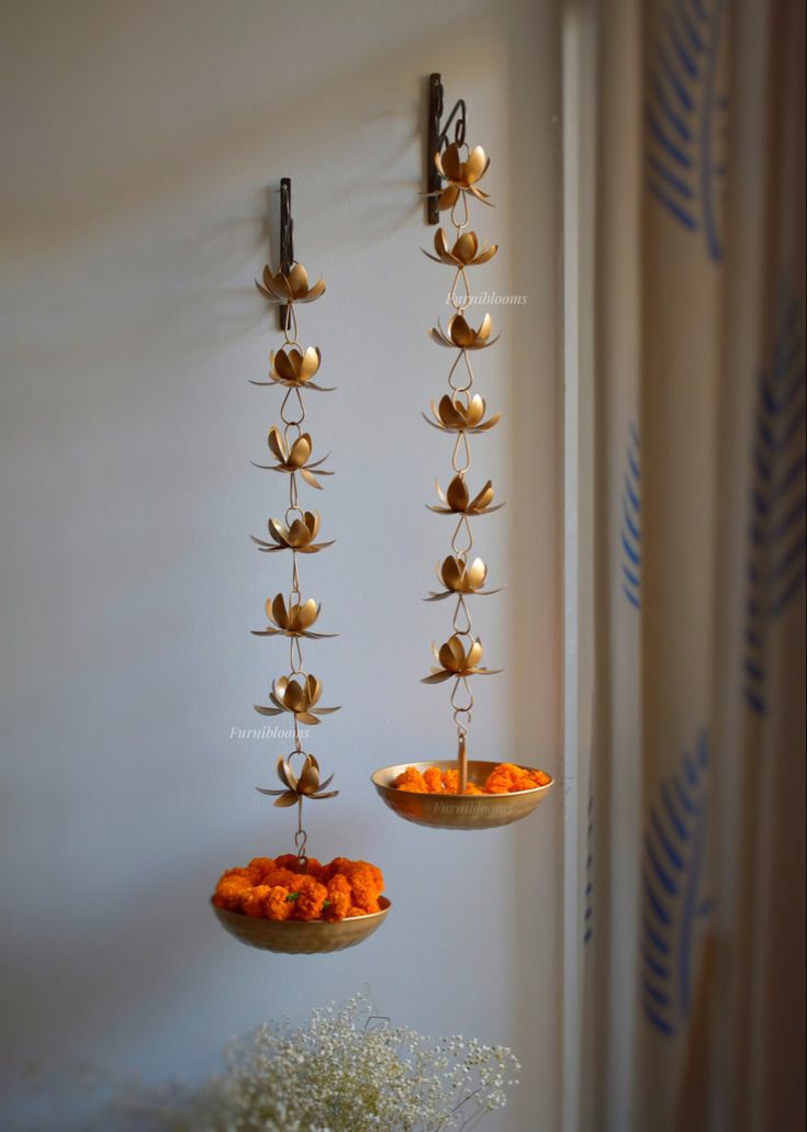 Flower Hanging "Blossom Bliss: Flower Hanging Urli Stand, an Artistic Ensemble Bringing Nature's Beauty Indoors, Elevating Your Space with Timeless Elegance."