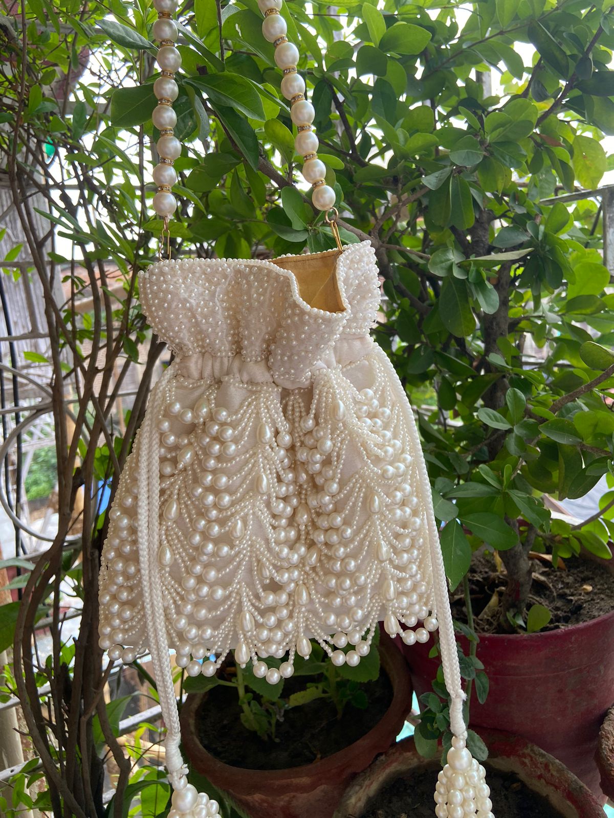 Heavy Designer Embroidered Pearl Potli With Latkans